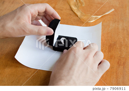 Person wrapping engagement ring Person wrapping engagement ring 7906911