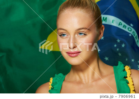 Young woman in front of Brazilian flag Young woman in front of Brazilian flag 7906961