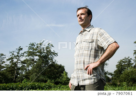 Farmer standing in field 7907061