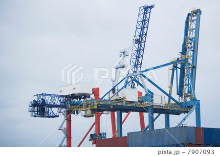 Crane and containers on loading dock 7907093