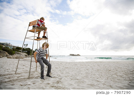 Two boys on lifeguard tower 7907290