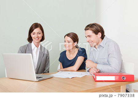 Young couple with financial adviser Young couple with financial adviser 7907338