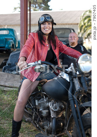 Woman sitting on motorcycle 7907405