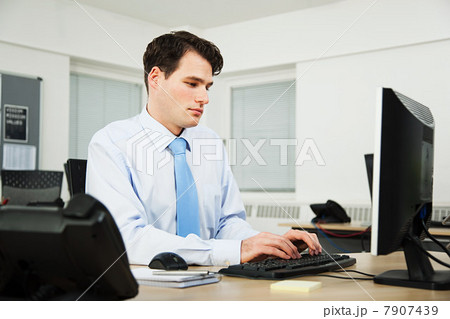 Office worker using computer Office worker using computer 7907439