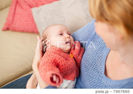 Mother holding newborn daughter Mother holding newborn daughter 7907660