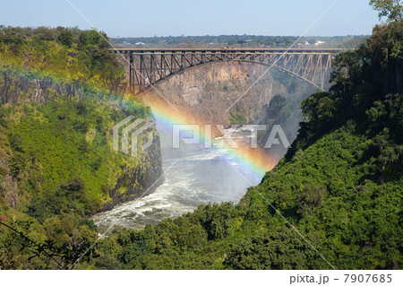 Rainbow over the Zambezi River and Victoria Falls Bridge.  Zambia on right of  bridge, Zimbabwe on left 7907685