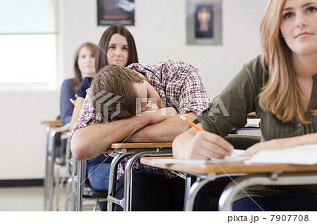 Male high school student asleep in class 7907708