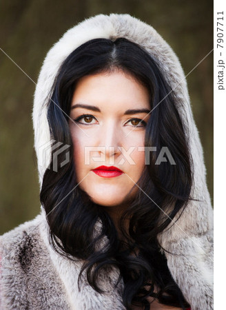 Young woman wearing fur hood Young woman wearing fur hood 7907711