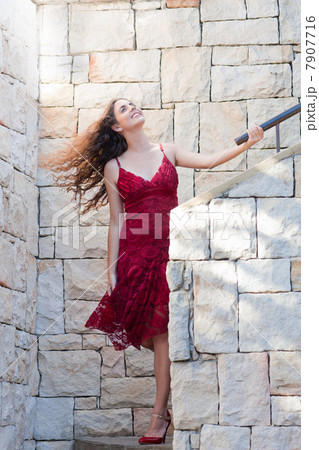 Woman climbing stone steps outdoors Woman climbing stone steps outdoors 7907716