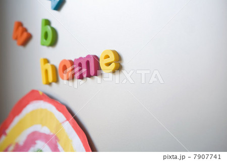 Letters spelling "home" on family refrigerator 7907741