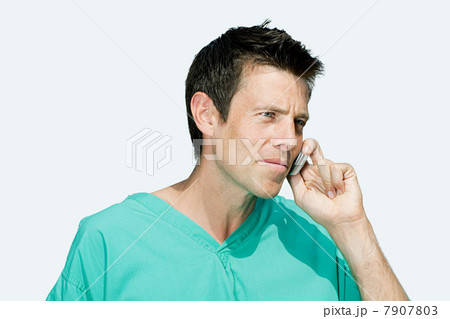 Portrait of a surgeon on cellphone 7907803