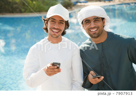 Two Middle Eastern men with mobile phones 7907913