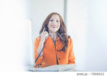 Businesswoman talking on phone at desk Businesswoman talking on phone at desk 7908032