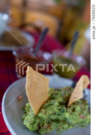Tortilla chips and guacamole 7908620
