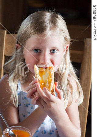 Girl eating bread Girl eating bread 7908950