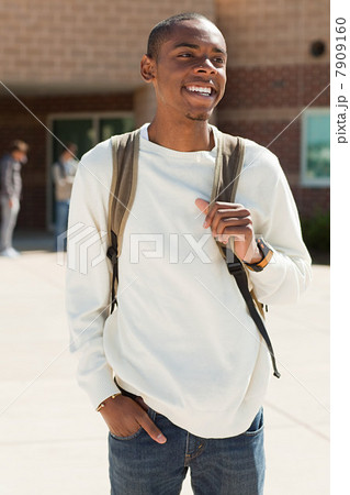 Male high school student outside school building 7909160