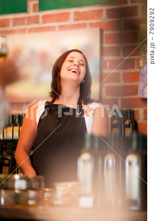 Server laughing in grocery store Server laughing in grocery store 7909292