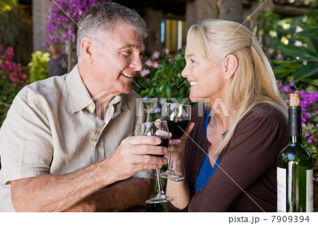 Mature couple having red wine 7909394