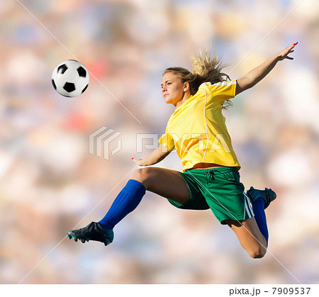 Soccer player kicking in mid-air 7909537