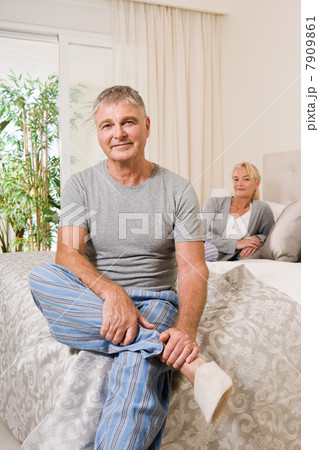 Mature couple in bedroom 7909861