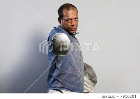 Portrait of senior man in fencing suit 7910201