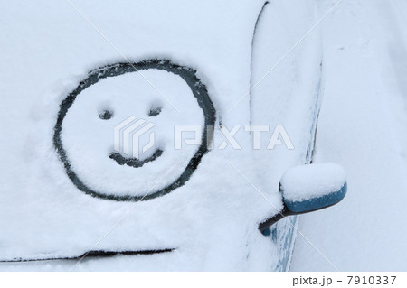 Smiley face drawn in snow on car windscreen Smiley face drawn in snow on car windscreen 7910337