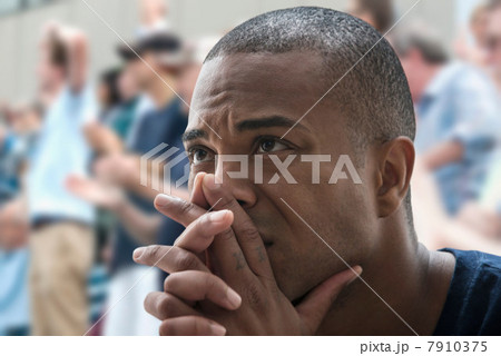 Tense man at sports game 7910375