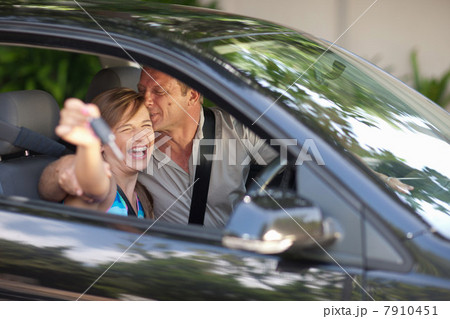 Father giving teenage daughter new car Father giving teenage daughter new car 7910451