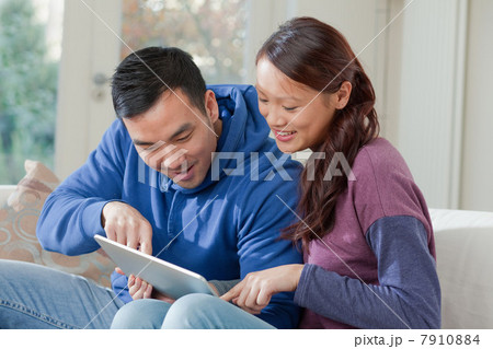 Couple using tablet computer together Couple using tablet computer together 7910884
