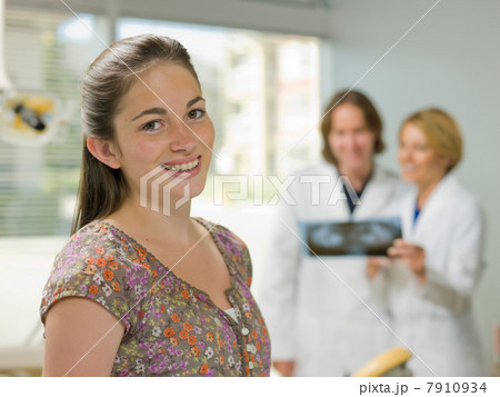 Young woman smiling in dentist's office, portrait Young woman smiling in dentist's office, portrait 7910934