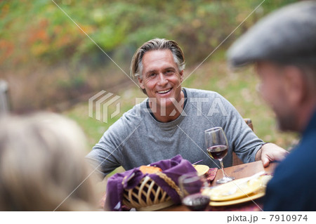Mature man at outdoor dinner Mature man at outdoor dinner 7910974