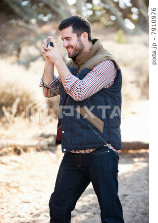 Man taking picture outdoors Man taking picture outdoors 7910976