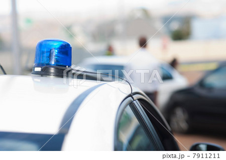 View of car accident scene from flashlights on police car 7911211