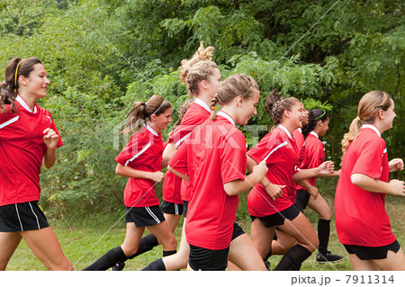 Girl soccer players running Girl soccer players running 7911314