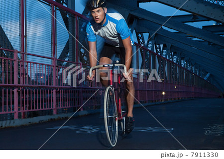 Cyclist riding on bridge Cyclist riding on bridge 7911330