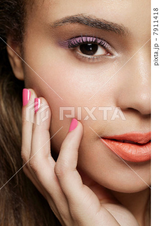 Cropped shot of young woman wearing make up Cropped shot of young woman wearing make up 7911418