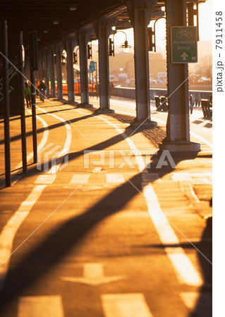 Cycle route below bridge at sunset  New York City, USA 7911458