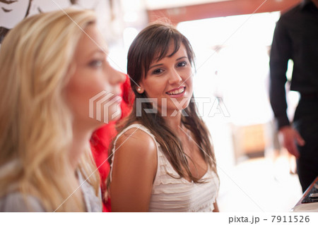 Smiling woman sitting in cafe Smiling woman sitting in cafe 7911526