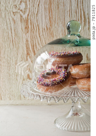 Doughnuts under glass jar Doughnuts under glass jar 7911825