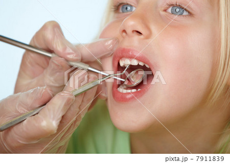 Girl having dental check up Girl having dental check up 7911839