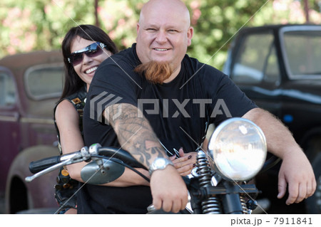 Couple sitting on motorcycle Couple sitting on motorcycle 7911841