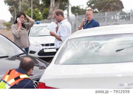 Man being breathalyzed at scene of car accident 7912056