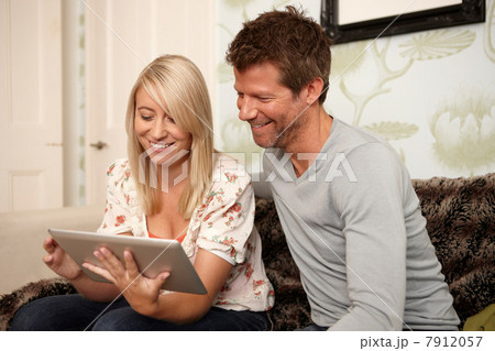 Couple using digital tablet Couple using digital tablet 7912057