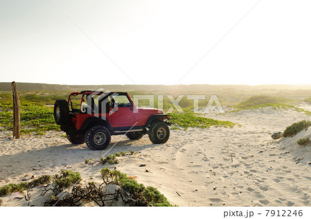 Off road vehicle on sand dunes 7912246