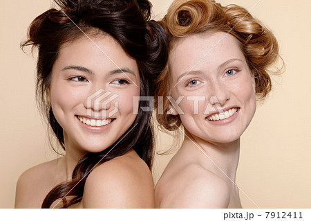 Two young women, one brunette and one redhead Two young women, one brunette and one redhead 7912411