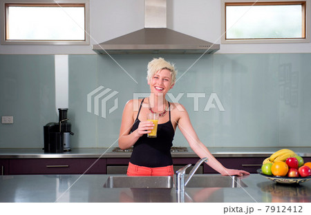 Young woman with glass of orange juice 7912412