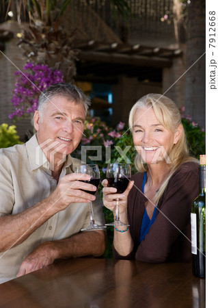 Mature couple having red wine 7912668