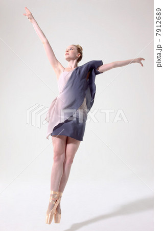 Ballerina jumping with arms raised and toes pointed Ballerina jumping with arms raised and toes pointed 7912689