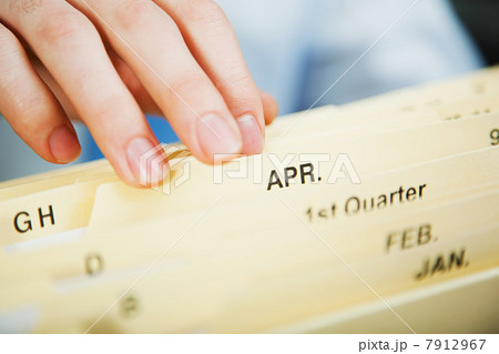Office worker filing document Office worker filing document 7912967