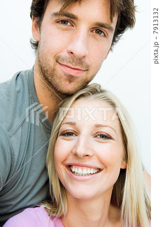 Young couple smiling on staircase 7913132
